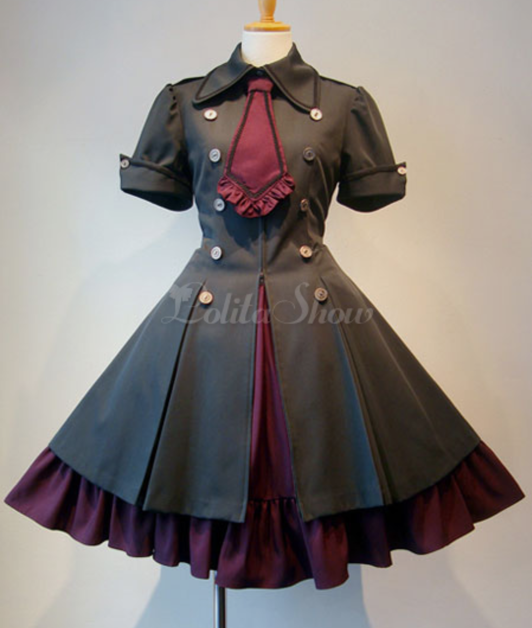 Black dress with maroon underskirt and large maroon tie