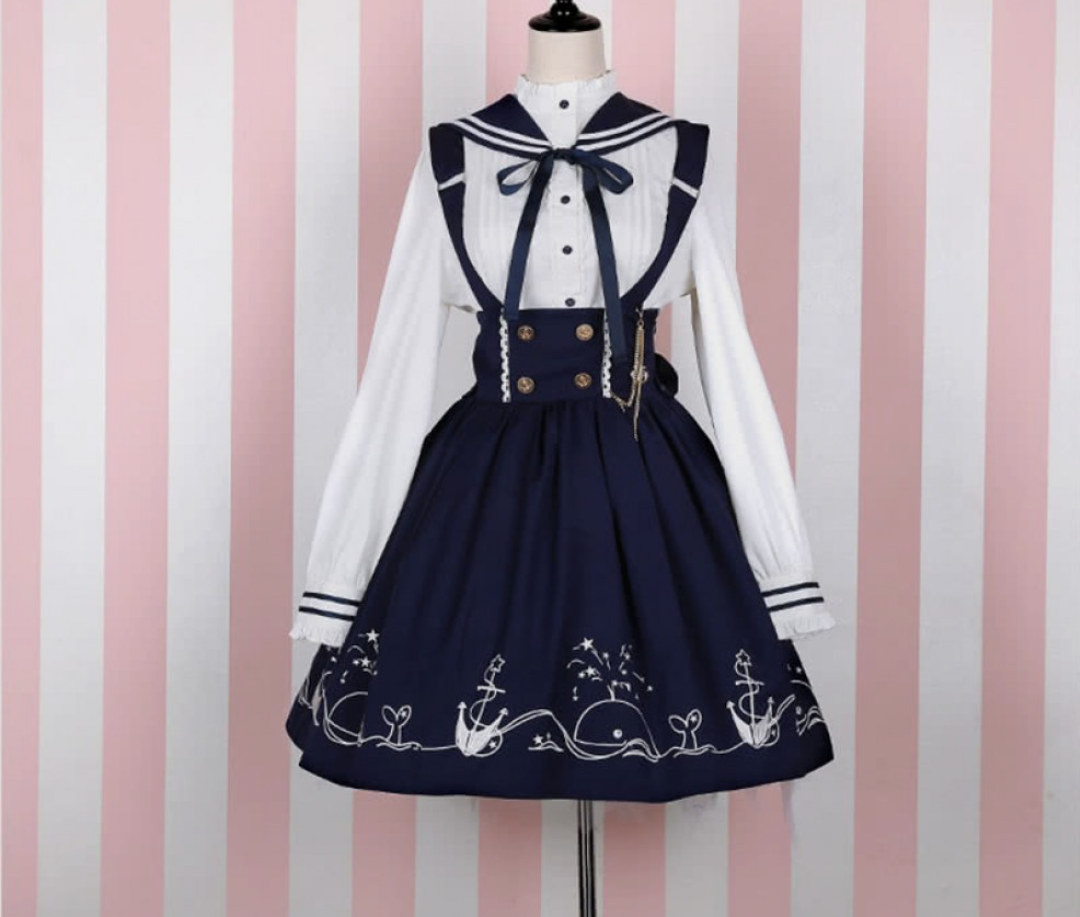 Navy and white sailor dress with whales along the skirt